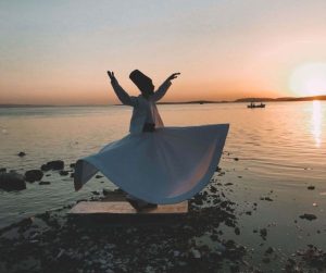 derviscio rotante tramonto mare sama Rumi